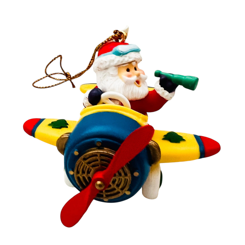 Vintage Traditions Santa Santa in a Airplane Christmas Ornament