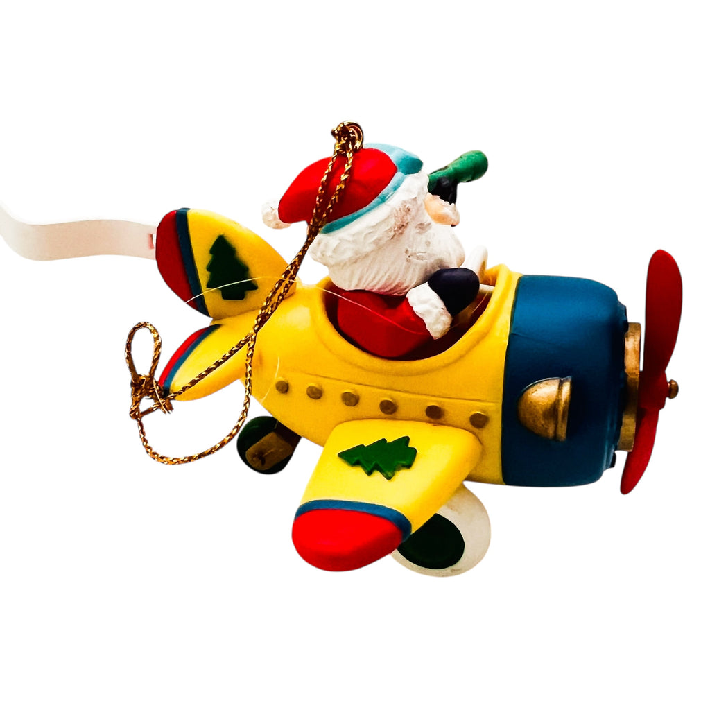 Vintage Traditions Santa Santa in a Airplane Christmas Ornament