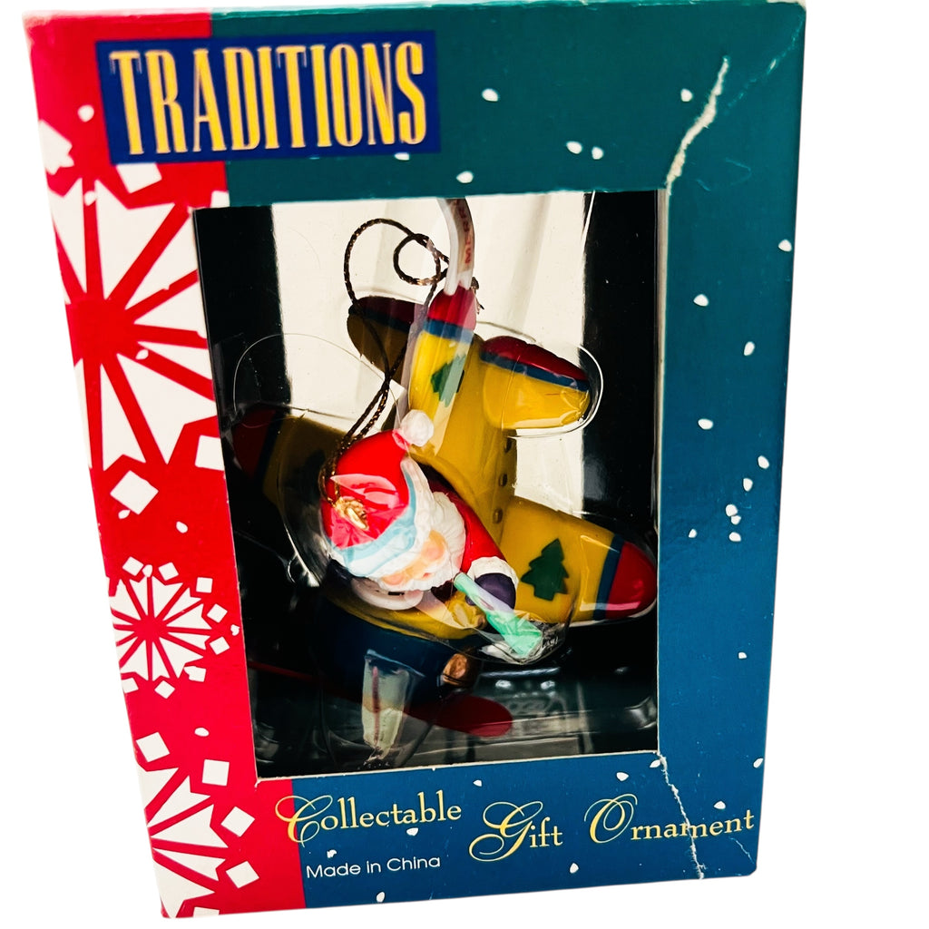 Vintage Traditions Santa Santa in a Airplane Christmas Ornament